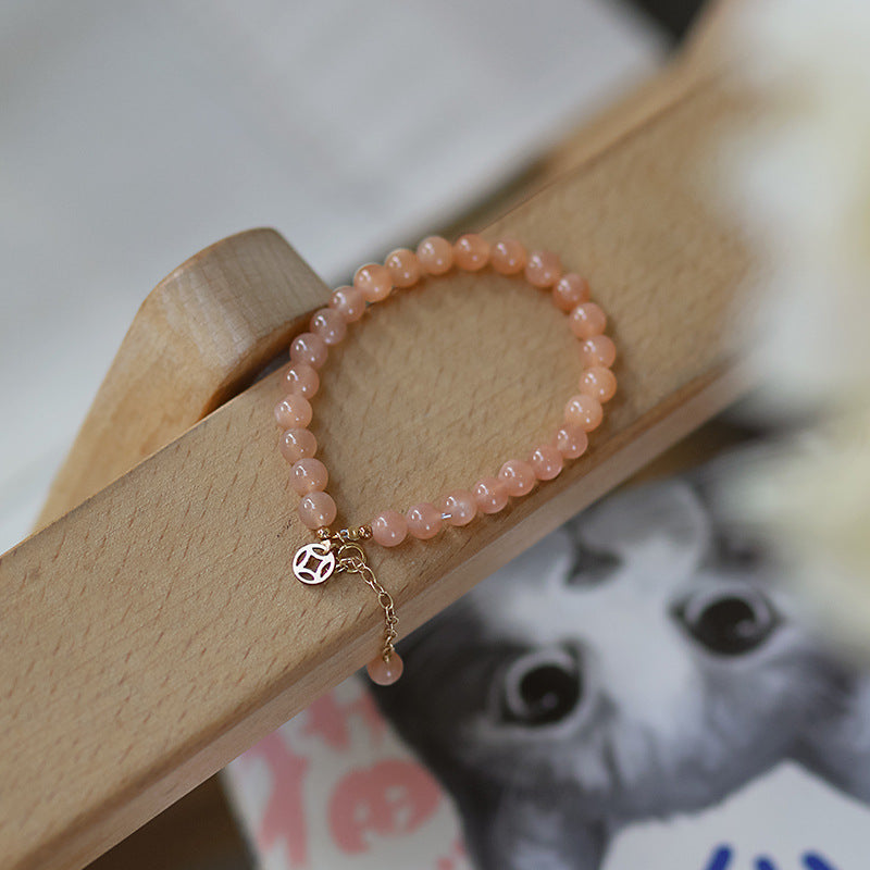 Pulsera de moneda de piedra solar naranja natural