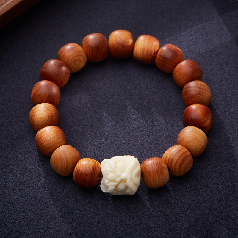 Pulsera de cuentas de tuya y león