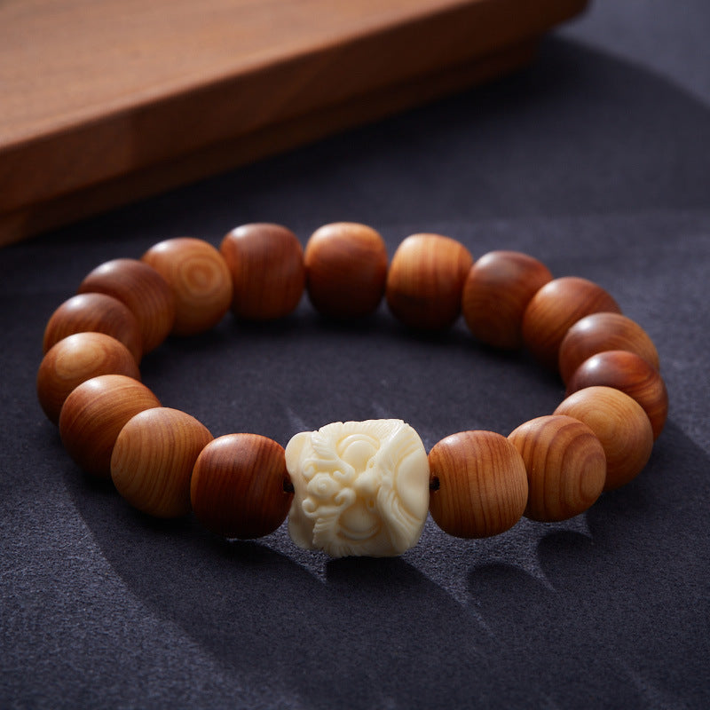 Pulsera de cuentas de tuya y león
